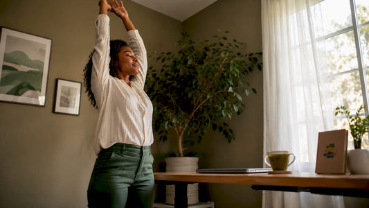 Woman stretching during standing break in office