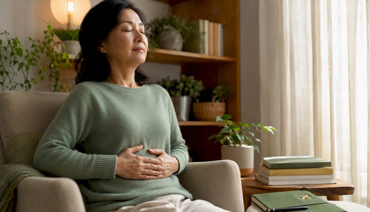 Woman practicing seated breathing at desk